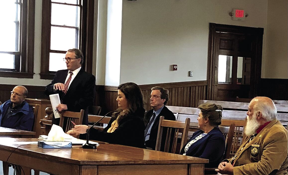 Judge weights Strang's request to join second suit against county reps